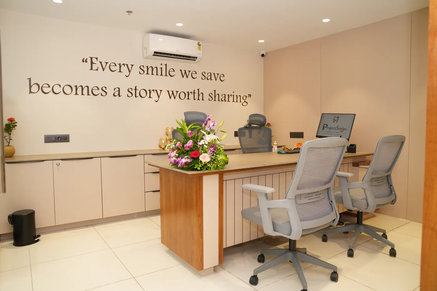 Consultation desk beneath the clinic's wall quote