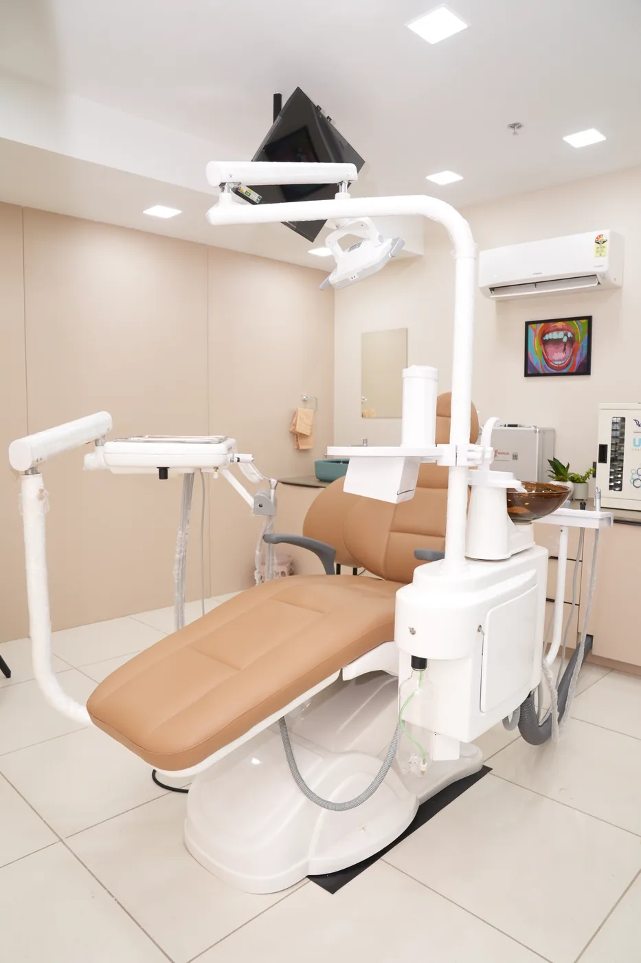 Treatment room with dental chair and overhead light