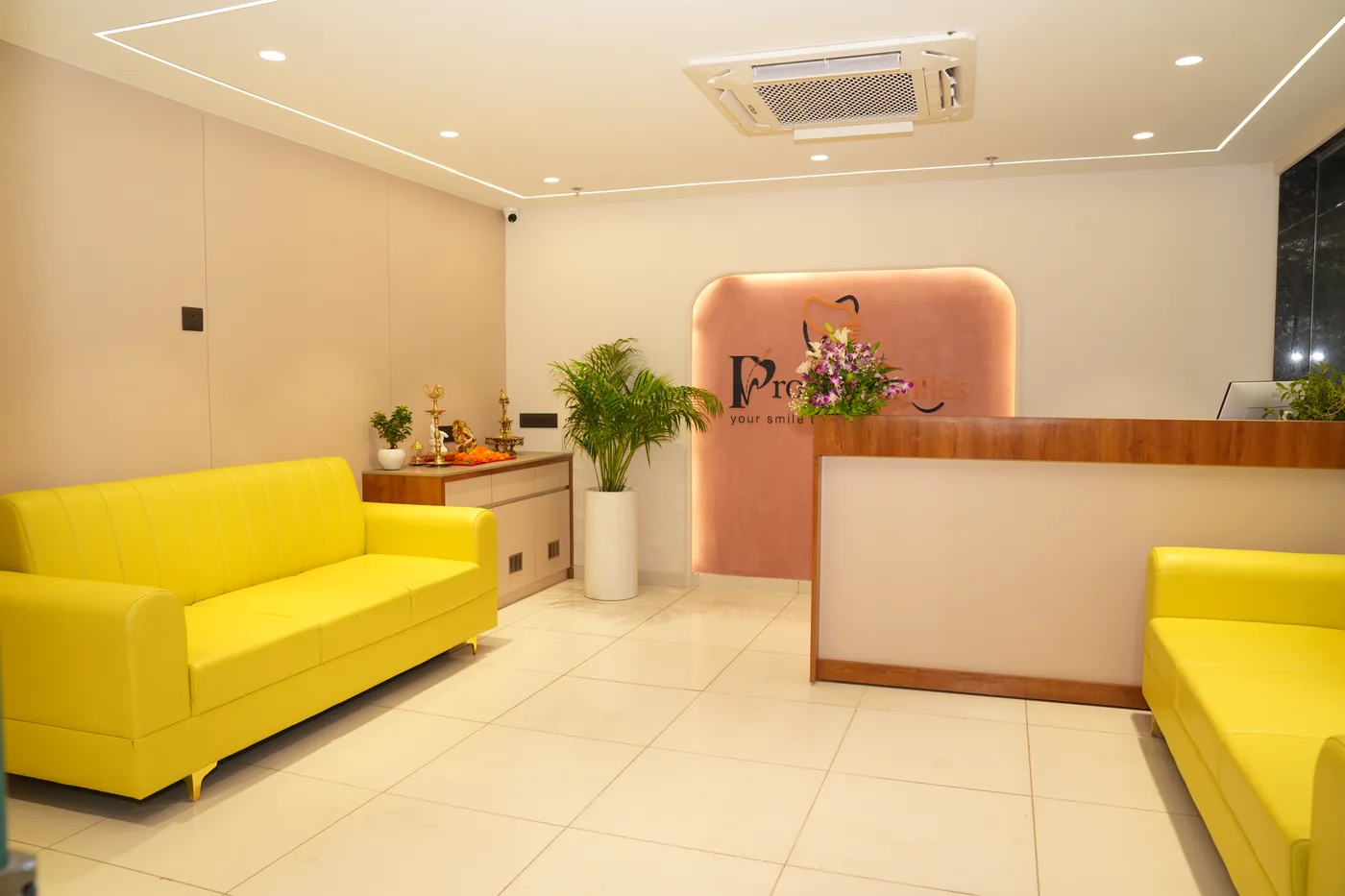 Waiting area with reception counter, seating and plants